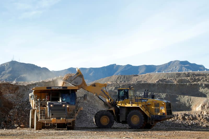 FILE PHOTO: A wheel loader operator fills a truck with ore at the MP Materials rare earth mine in Mountain Pass