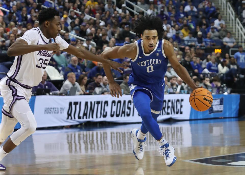 Kentucky’s Jacob Toppin drives the ball against Kansas State’s Nae’Qwan Tomln in the second round of the NCAA Tournament.March 19, 2023