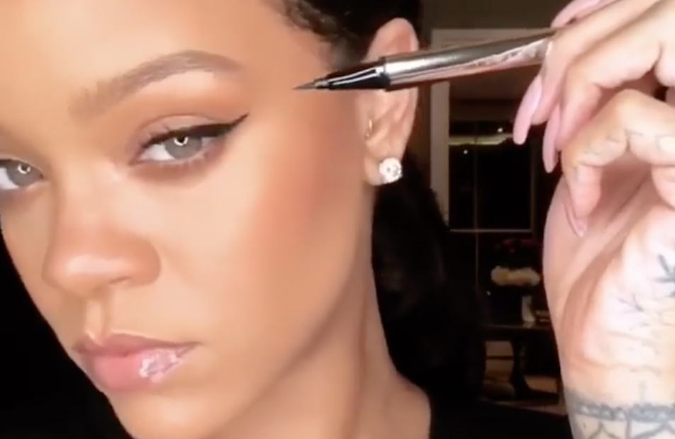 Rihanna applies her new Fenty eyeliner, Flyliner, which comes out July 6. (Photo: Fenty via Instagram)