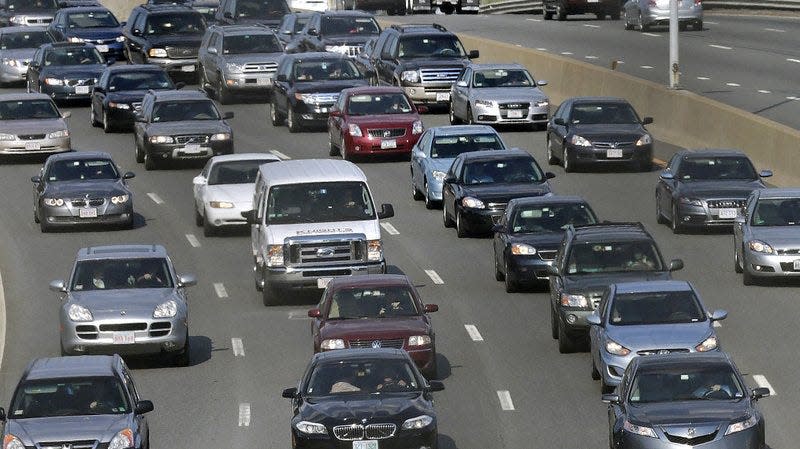 Traffic advances along the Massachusetts Turnpike in Boston.