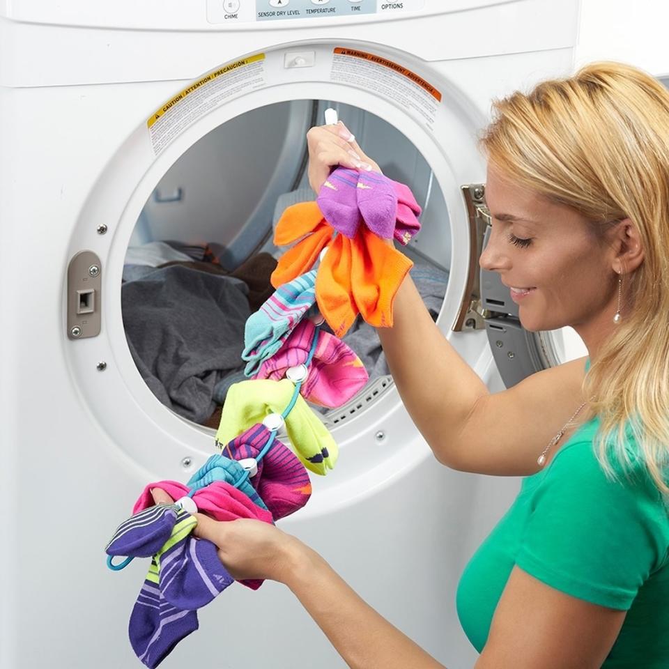 Just attach your socks in pairs on this clever clip and throw them in the wash. This will keep them together and save you <i>loads</i> of time whenever you do laundry.<br /><br /><strong>Promising review:</strong> "These work. They are of good quality construction. I had a sock problem, and <strong>these have stopped the unexplained disappearance of socks.</strong> Obviously, the sock monster can't swallow the Sock Dock full of socks, only single socks." &mdash; <a href="https://amzn.to/3e9UbvW" target="_blank" rel="nofollow noopener noreferrer" data-skimlinks-tracking="5902331" data-vars-affiliate="Amazon" data-vars-href="https://www.amazon.com/gp/customer-reviews/RGL4XLUQTABEF?tag=bfmal-20&amp;ascsubtag=5902331%2C23%2C37%2Cmobile_web%2C0%2C0%2C16540735" data-vars-keywords="cleaning" data-vars-link-id="16540735" data-vars-price="" data-vars-product-id="15939327" data-vars-retailers="Amazon">A.D. Burnette</a>﻿<br /><br /><strong>Get it from Amazon for <a href="https://amzn.to/2RyIxTH" target="_blank" rel="nofollow noopener noreferrer" data-skimlinks-tracking="5902331" data-vars-affiliate="Amazon" data-vars-asin="B07BXJ32Q8" data-vars-href="https://www.amazon.com/dp/B07BXJ32Q8?tag=bfmal-20&amp;ascsubtag=5902331%2C23%2C37%2Cmobile_web%2C0%2C0%2C16540664" data-vars-keywords="cleaning" data-vars-link-id="16540664" data-vars-price="" data-vars-product-id="18051235" data-vars-product-img="https://m.media-amazon.com/images/I/51Nn2sfq5rL.jpg" data-vars-product-title="SockDock Sock Laundry Tool &amp; Storage Hanger for Washing Drying &amp; Storing Paired Socks, Clips &amp; Locks, No Sorting or Matching, Foldable Closet Organizer Better Than Mesh Bag, 2-Pack (Blue)" data-vars-retailers="Amazon">$16</a> (available in three colors).</strong>