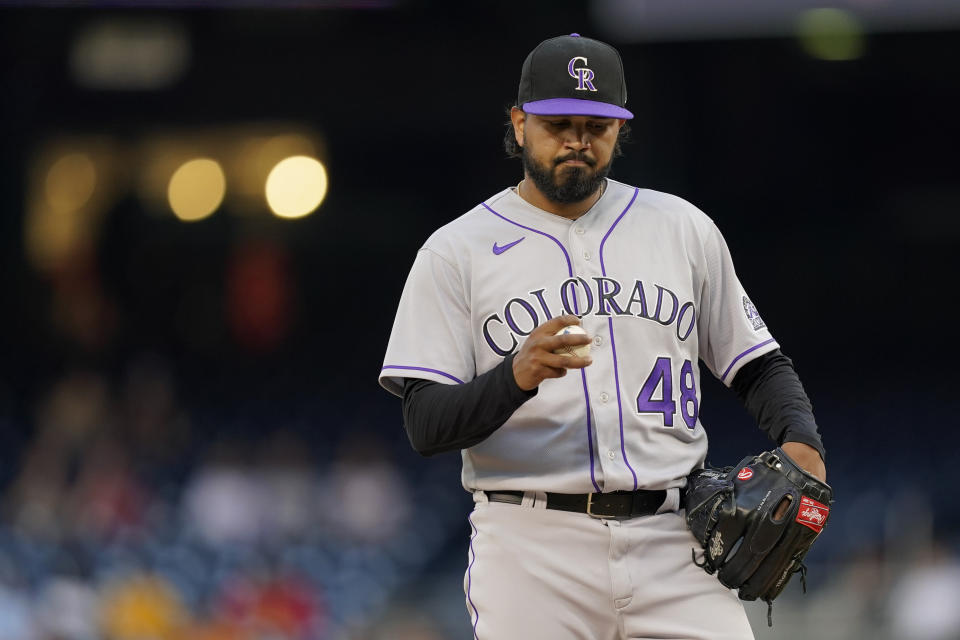 Colorado Rockies starting pitcher German Marquez pauses on the mound after Washington Nationals' Cesar Hernandez scored on Nelson Cruz's single in the first inning of a baseball game, Thursday, May 26, 2022, in Washington. Washington scored four runs in the first. (AP Photo/Patrick Semansky)