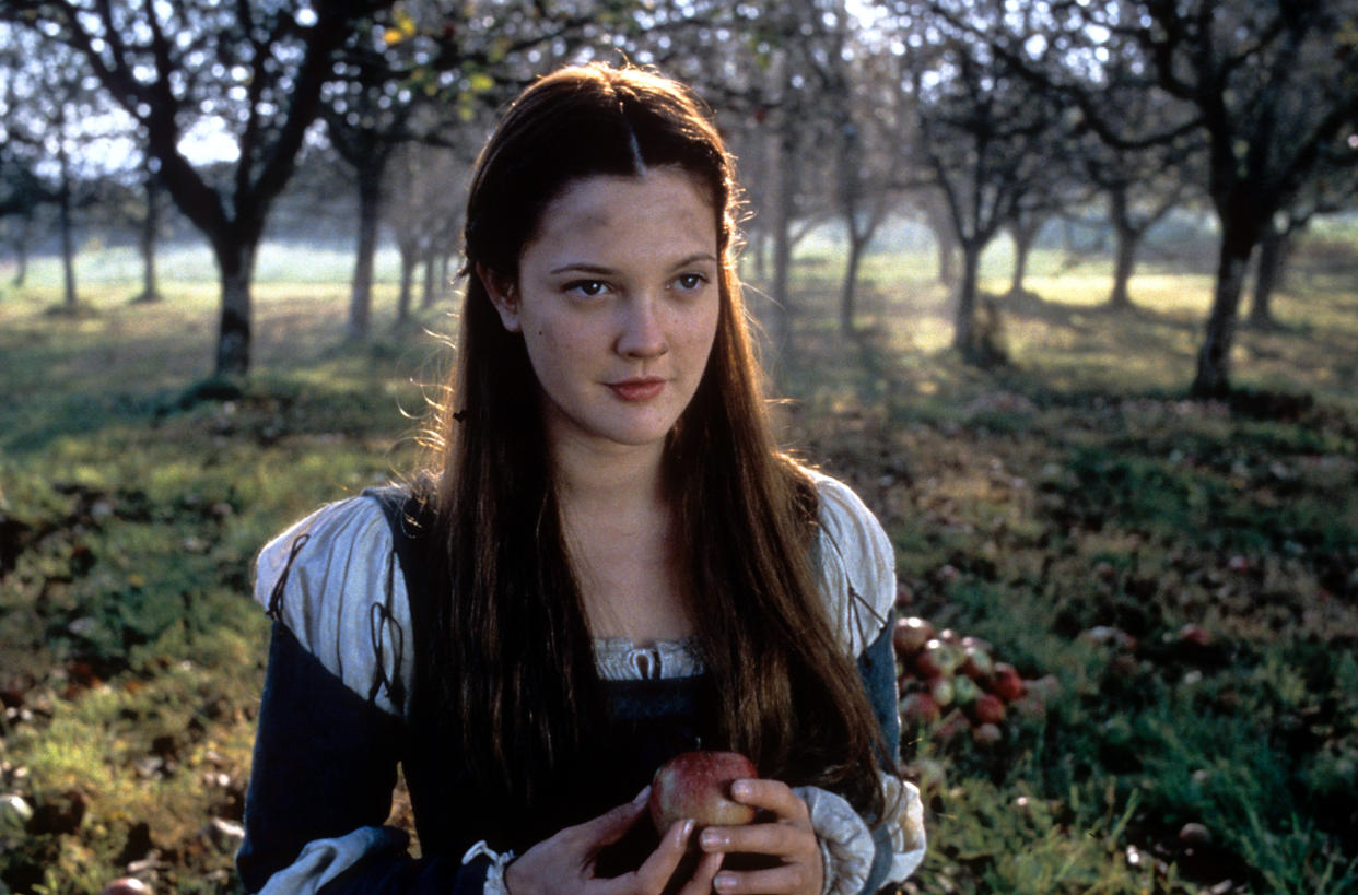 Drew Barrymore holding apple in a scene from the film 'Ever After: A Cinderella Story', 1998. (Photo by 20th Century-Fox/Getty Images)