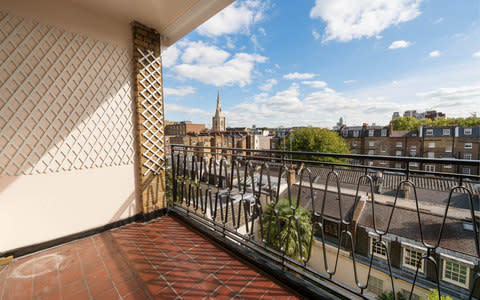 The apartment has a private balcony with views over the peaceful gardens of Eaton Square