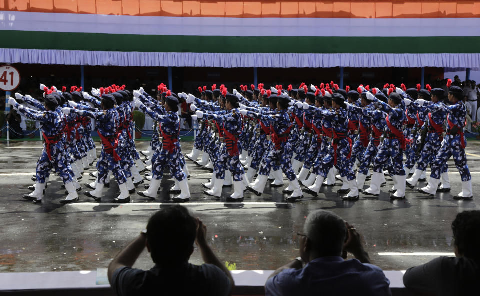 police women belonging to the West Bengal Rapid Action Force contingent take part in the march past during Independence Day ceremonial parade in Kolkata, India, Wednesday, Aug. 15, 2018. India won independence from British colonialists in 1947. (AP Photo/Bikas Das)