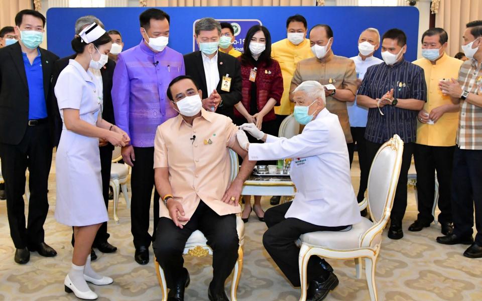 Thai Prime Minister Prayut Chan-o-cha receiving a shot of the Oxford/AstraZeneca vaccine - Shutterstock