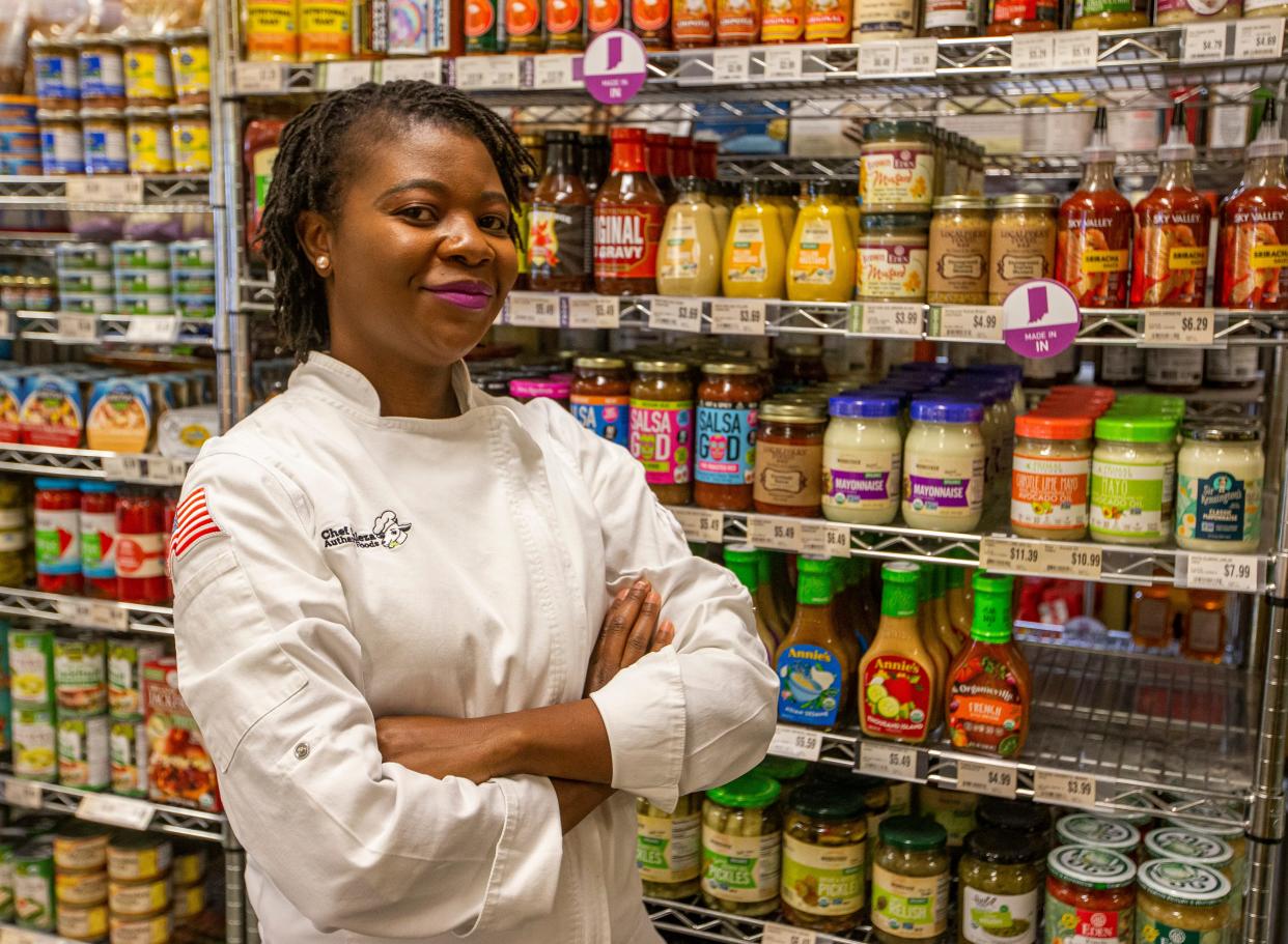 Kuleza Kadyakale, a Malawi native and Mishawaka resident, stands inside Purple Porch Co-op in South Bend, where her Chef Kuleza Hot Sauce is sold.