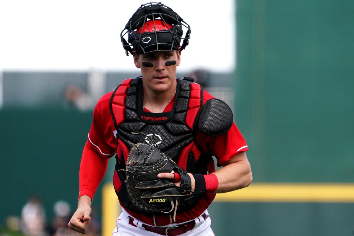 Cincinnati Reds' Tyler Stephenson blows a bubble as he runs the bases  during a baseball game