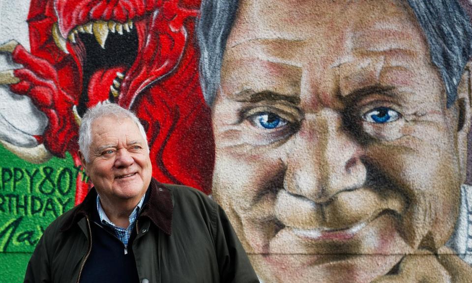 <span>Singer and entertainer Max Boyce stands in front of a mural in tribute to himself in Glynneath, Wales.</span><span>Photograph: Dimitris Legakis/The Guardian</span>