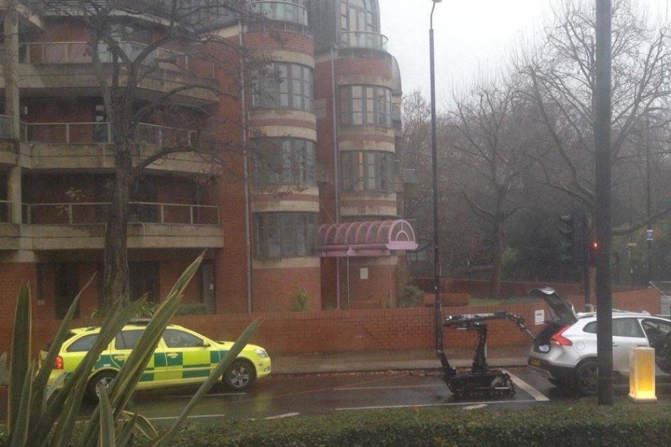 A Met Police device searches the boot of the car. (coops_tv/Twitter)