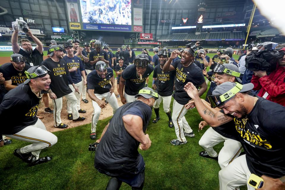 Milwaukee Brewers' players celebrate after clinching the National League Central Division after a baseball game against the St. Louis Cardinals Tuesday, Sept. 26, 2023, in Milwaukee. (AP Photo/Morry Gash)