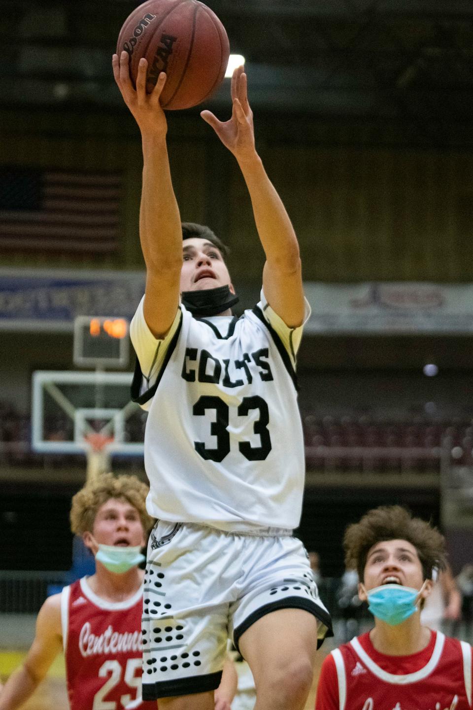 Pueblo South High School's Mateo Esquivel goes up high for a layup against Pueblo Centennial at the Southwest Motors Events Center on Tuesday, January 18, 2022.