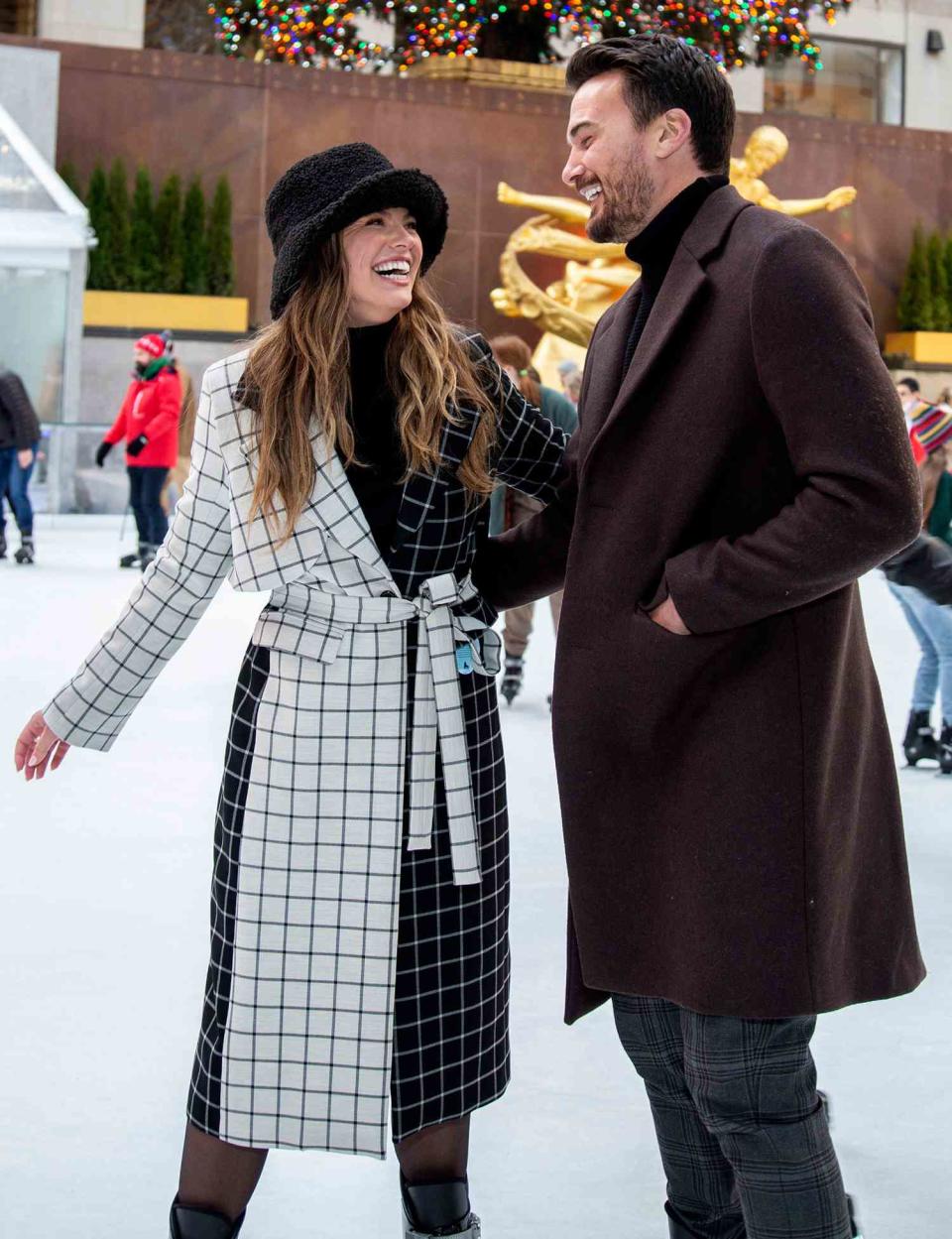 Hannah Brown and Adam Woolard visit 'The Rink' at Rockefeller Center on December 10, 2021 in New York City