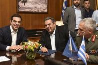 Greek Prime Minister Alexis Tsipras (L), Defence Minister Panos Kammenos (C) and General Mikhail Kostarakos, chief of Hellenic National Defence General Staff, meet at the Defence ministry premises in this handout photo released by the Greek Defence Ministry in Athens, Greece July 2, 2015. REUTERS/Greek Defence Ministry/Handout via Reuters