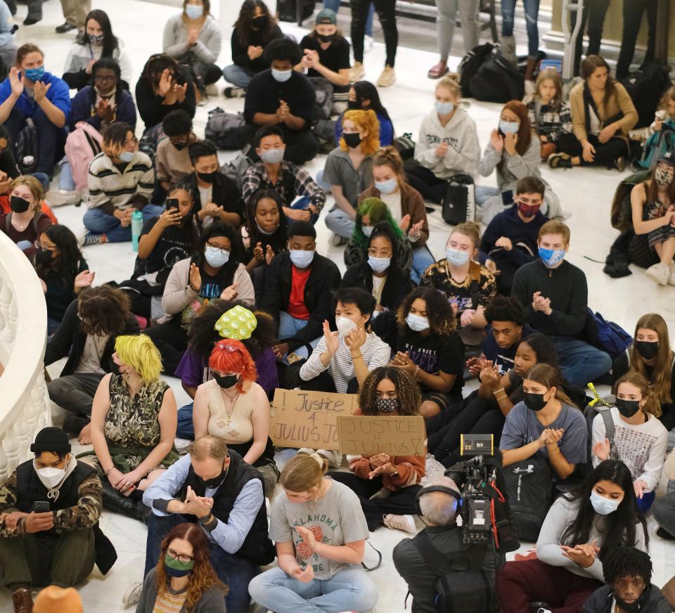 Students listen to Jabee Williams speak Wednesday during a vigil for Julius Jones.