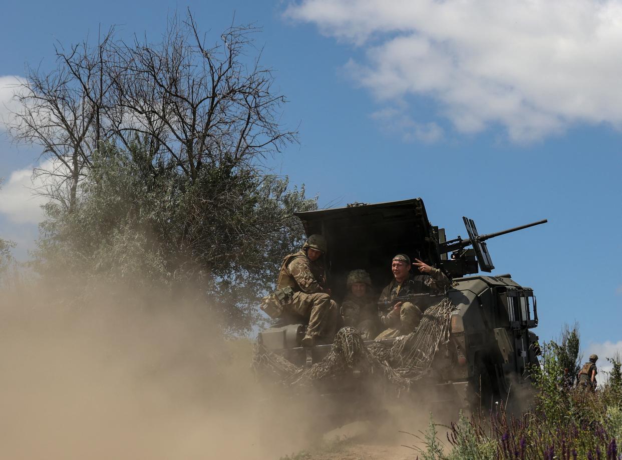 Ukrainian servicemen of the 35th Separate Marines Brigade ride in a HMMWV (Humvee) vehicle at a training ground, amid Russia's attack on Ukraine, in Donetsk region (REUTERS)