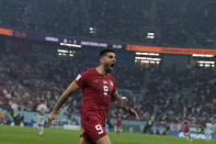 Serbia's Aleksandar Mitrovic celebrates after scoring his side's first goal during the World Cup group G soccer match between Serbia and Switzerland, in Doha, Qatar, Qatar, Friday Dec. 2, 2022. (AP Photo/Ricardo Mazalan)