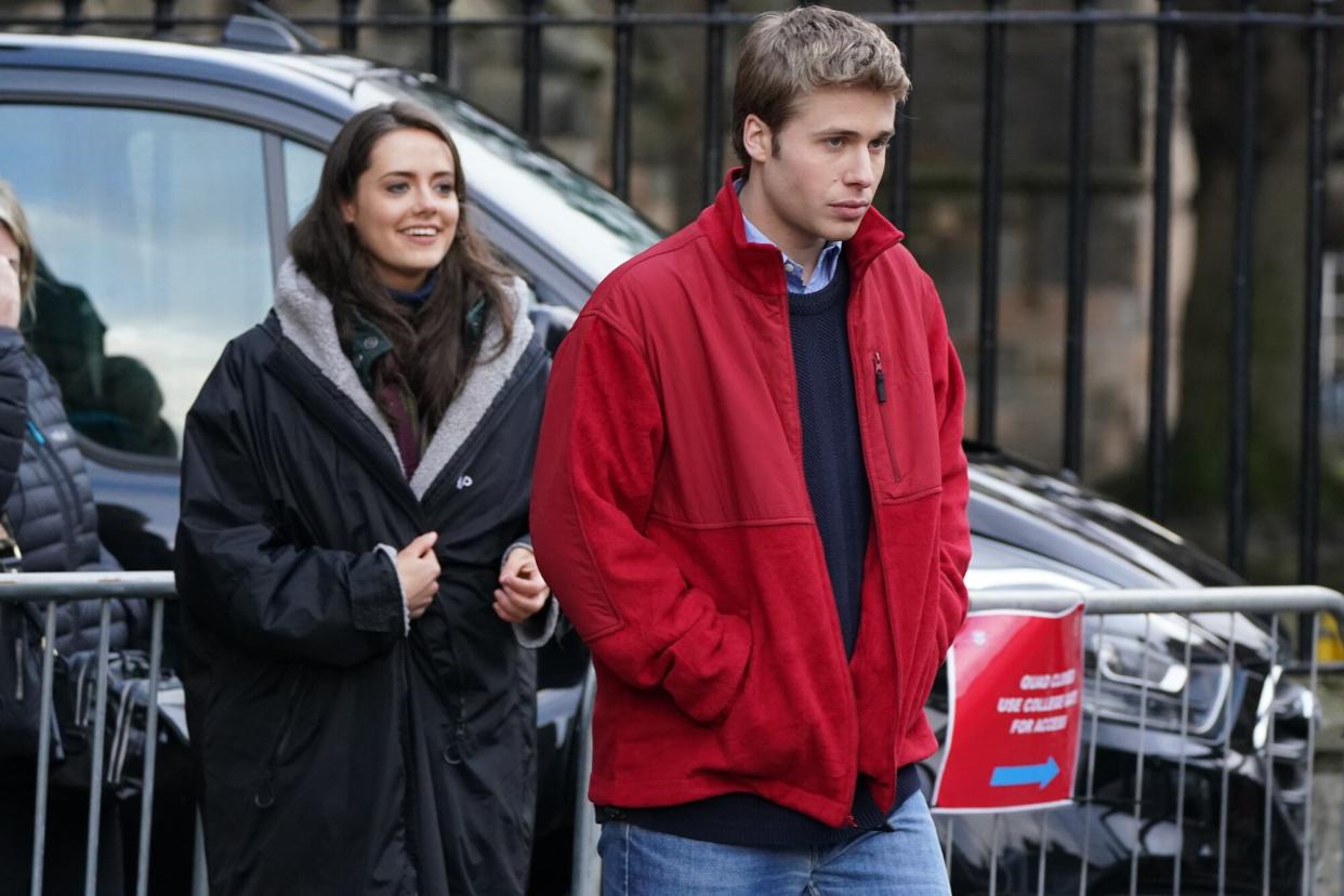 Actors Ed McVey, as Prince William and actress Meg Bellamy, who plays Kate Middleton in between filming scenes for the next season of The Crown in St Andrews, Scotland. Picture date: Thursday March 16, 2023.