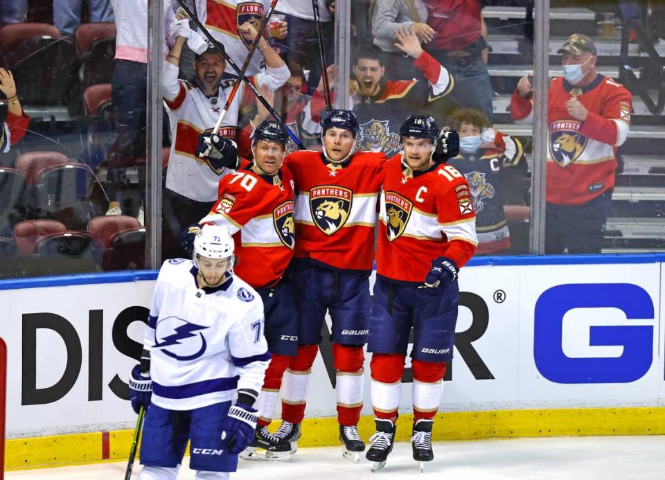 Florida Panthers players Patric Hornqvist (70) Sam Bennett (9) and Aleksander Barkov (16) reacting after no-goal on a shot by Panthers center Sam Bennett during the first period of game 1 of their first round NHL Stanley Cup series against the Tampa Bay Lightning at the BB&T Center on Sunday, May 16, 2021 in Sunrise, Fl.