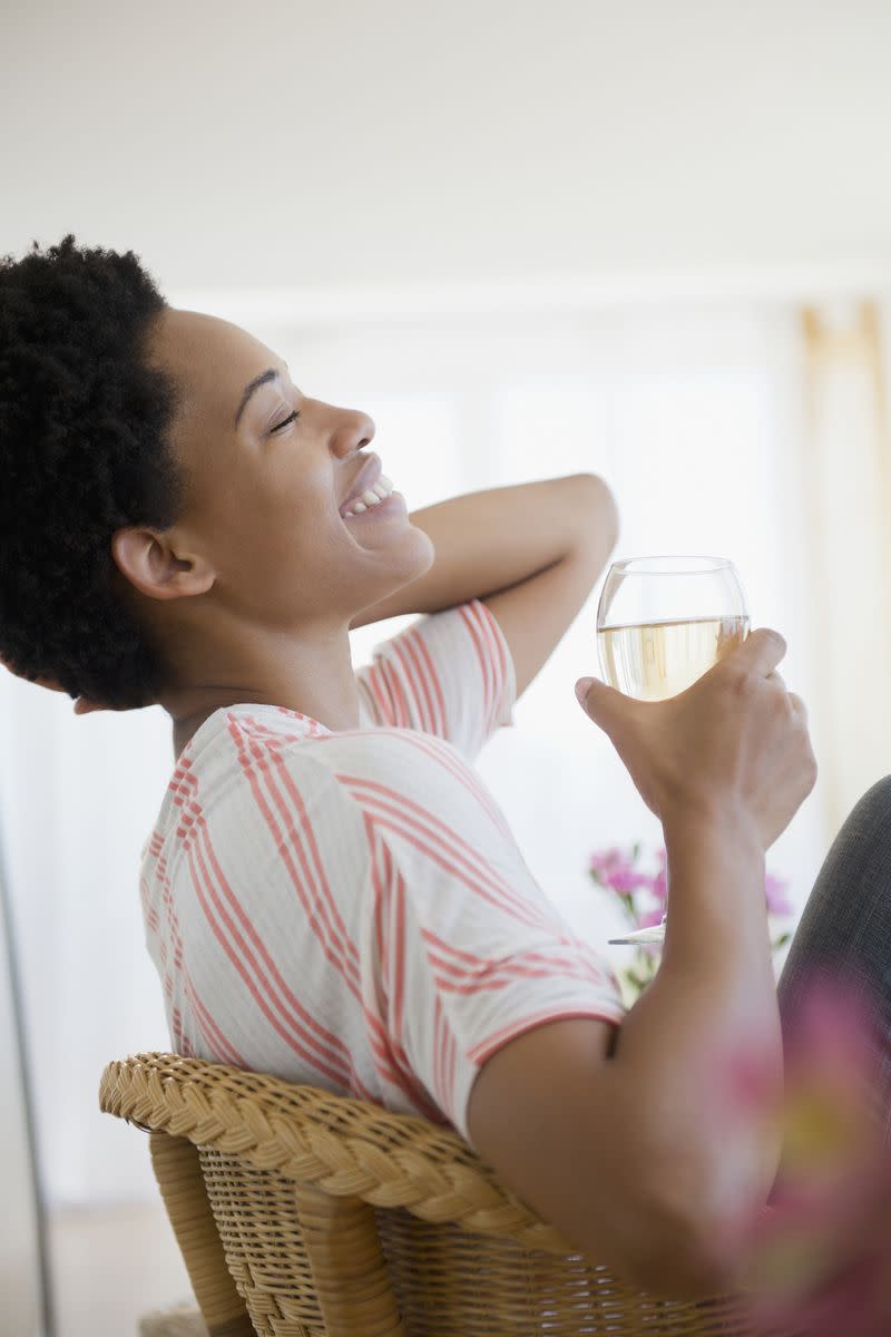 A woman enjoying a glass of wine