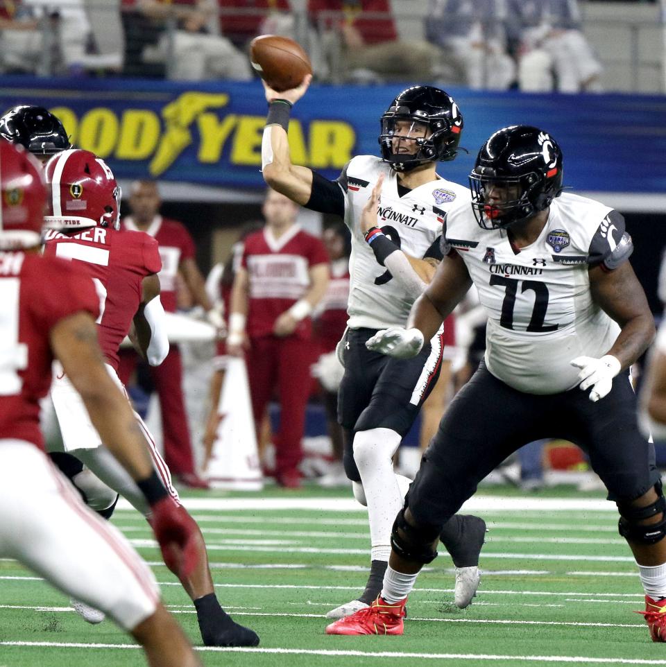 Cincinnati Bearcats quarterback Desmond Ridder makes a throw during the 2nd half of the College Football Playoff Semifinal at the 86th  Cotton Bowl Classic Friday December 31, 2021 at AT & T Stadium in Arlington, Texas. UC lost to Alabama 27-6.