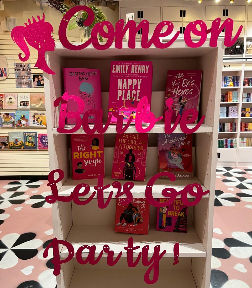 A topical section of romance books with "Barbie"-pink covers.