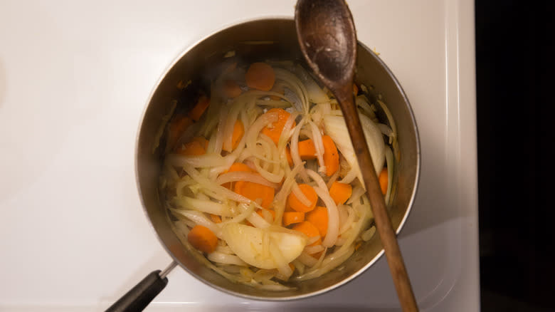 vegetables cooking in medium pot 