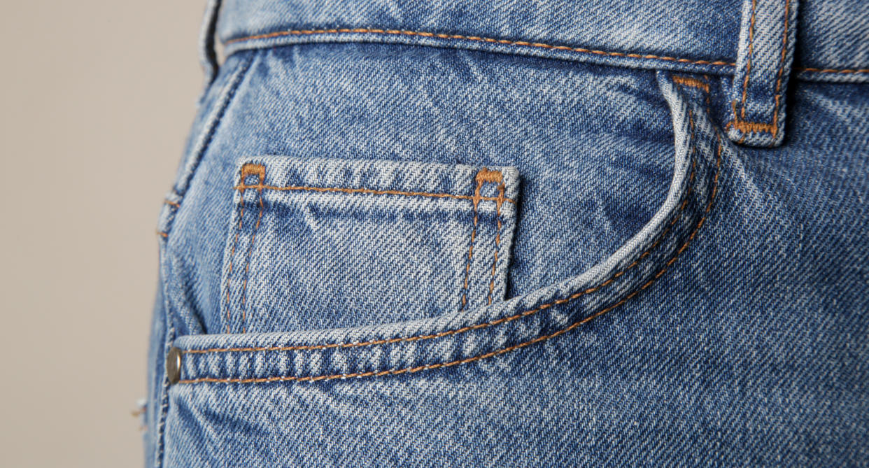 close up of a pair of jeans with a small pocket