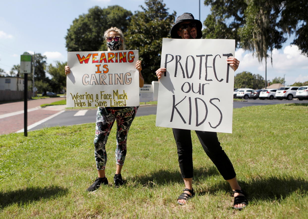 Supporters of wearing masks in schools protest before a Pinellas County Schools workshop to discuss the issue in Largo, Fla., on Aug. 9.