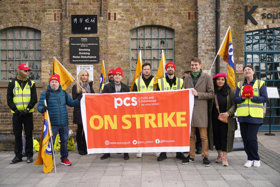 Members of the Public and Commercial Services (PCS) union on the picket line outside the Passport Office in east London, as more than 1,000 members of the PCS working in passport offices in England, Scotland and Wales begin a five week strike as part of the civil service dispute. Picture date: Monday April 3, 2023. (Photo by Yui Mok/PA Images via Getty Images)