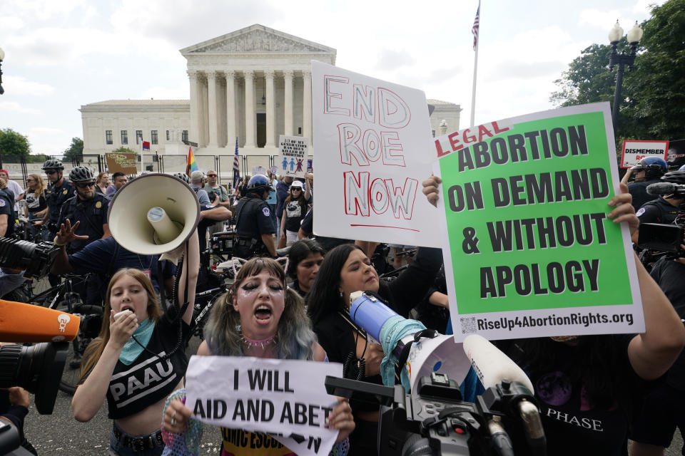 People protest about abortion, Friday, June 24, 2022, outside the Supreme Court in Washington. (AP Photo/Steve Helber)