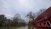 People walk through the Main Quadrangle at the University of Chicago in Chicago, Illinois, United States, November 30, 2015. The University canceled Monday classes and activities after being warned by the FBI that someone had made an online threat of gun violence on campus, university President Robert J. Zimmer announced on Sunday. (REUTERS/Jim Young)