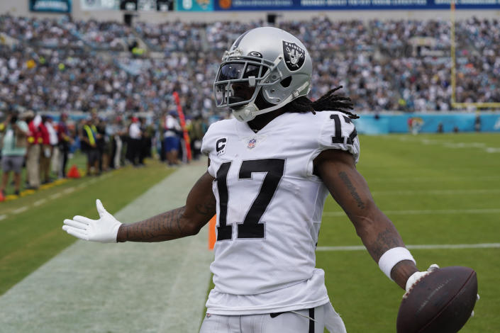 Las Vegas Raiders wide receiver Davante Adams (17) celebrates after scoring his second touchdown of the game on a 38-yard pass against the Jacksonville Jaguars in the first half of an NFL football game Sunday, Nov. 6, 2022, in Jacksonville, Fla. (AP Photo/John Raoux)