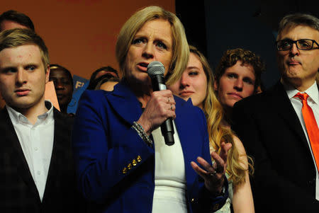 Alberta New Democratic (NDP) leader and Premier Rachel Notley, flanked by her son Ethan, daughter Sophie and husband Lou Arab, reacts to her loss at her election night party in Edmonton, Alberta, Canada, April, 16, 2019. REUTERS/Candace Elliott