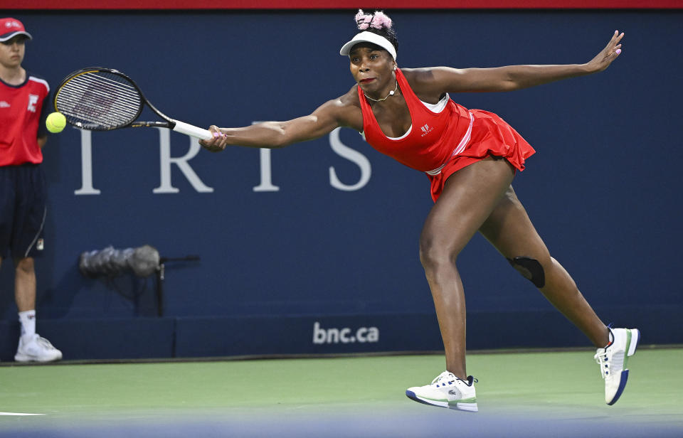 Venus Williams, of the United States, plays a shot during her women's first-round match against Madison Keys, also of the United States, at the National Bank Open tennis tournament in Montreal, Monday, Aug. 7, 2023. (Graham Hughes/The Canadian Press via AP)