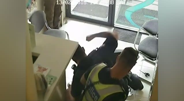 The footage shows the officer beating the young man with a police baton three times and kicking him in the head. Source: Fairfax Media