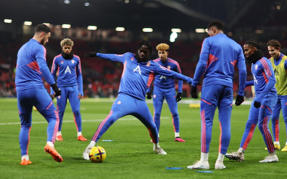 Darko Gyabi of Leeds United warms up with teammates prior to the Premier League match between Manchester United and Leeds United - Naomi Baker/Getty Images