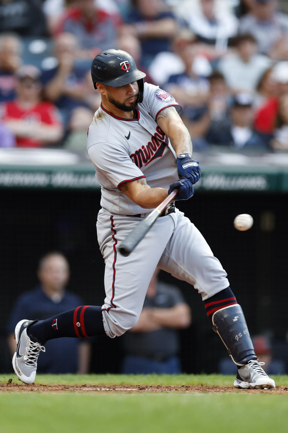 Minnesota Twins designated hitter Gary Sanchez hits an RBI-single against the Cleveland Guardians during the fourth inning of a baseball game Monday, June 27, 2022, in Cleveland. (AP Photo/Ron Schwane)