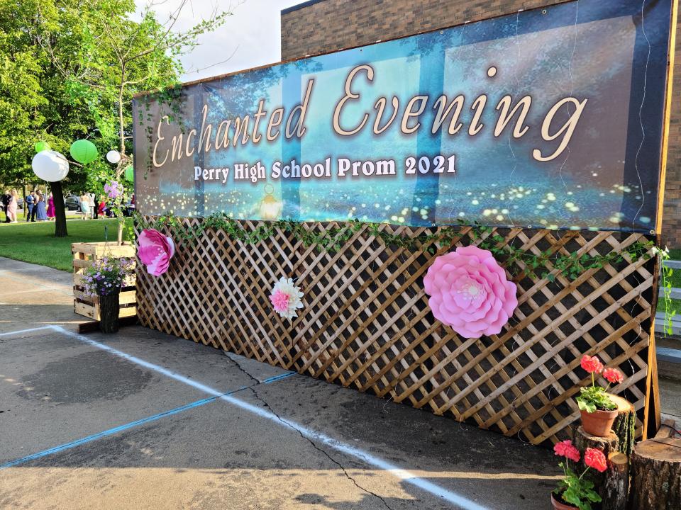 Perry High School students celebrate an "Enchanted Evening" grand march in 2021 at Wiese Park. The grand march will return outdoors in 2023 on Railroad Street.