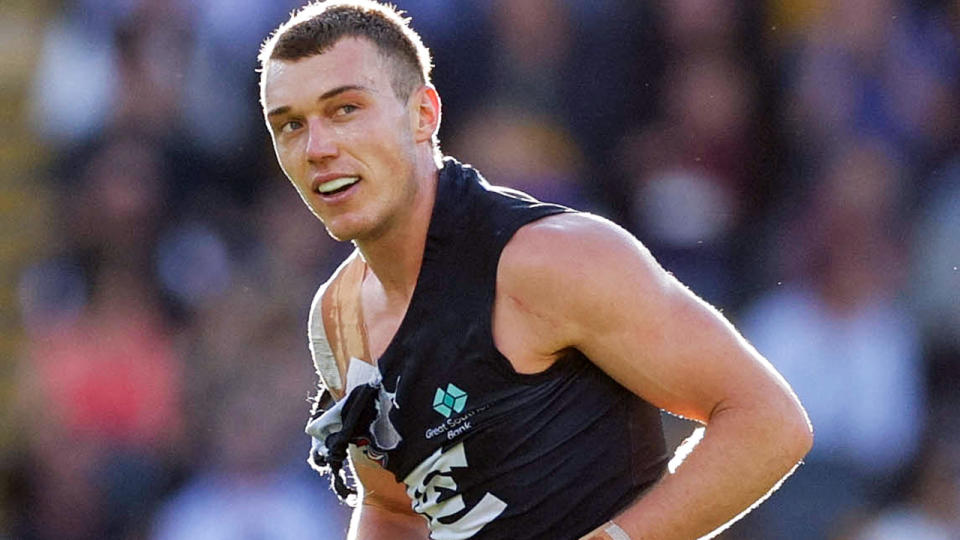 Patrick Cripps has his jersey ripped during the match against Brisbane.