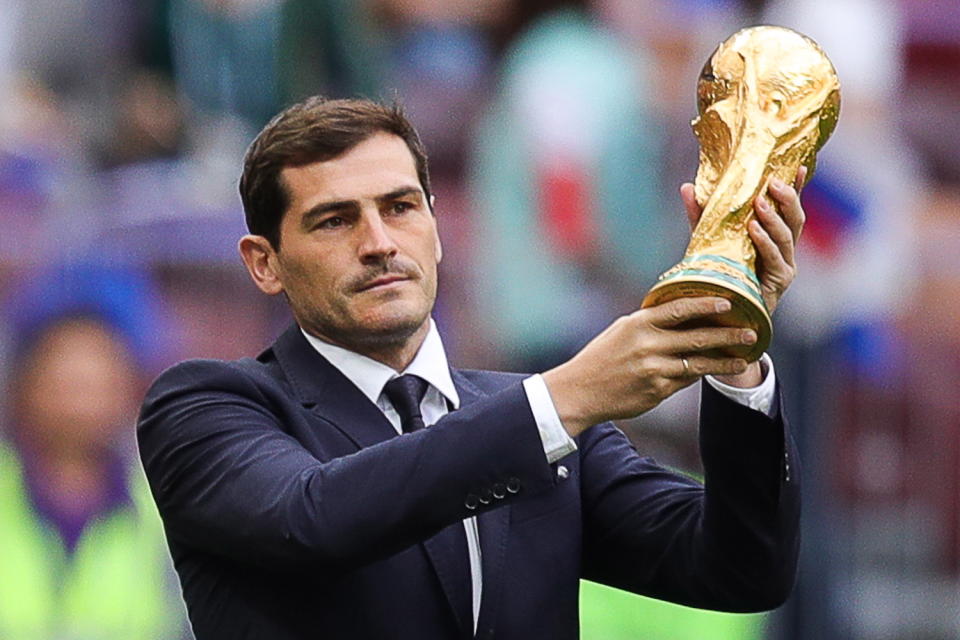 <p>Spanish legend Iker Casillas holds the 2018 FIFA World Cup trophy aloft before kick off. (Getty) </p>