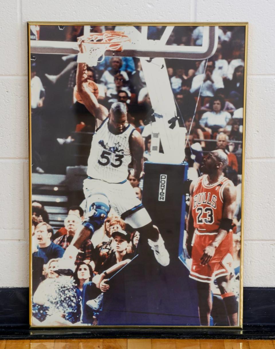 A framed photograph of Stanley Roberts dunking over Michael Jordan hangs at Lower Richland high school.