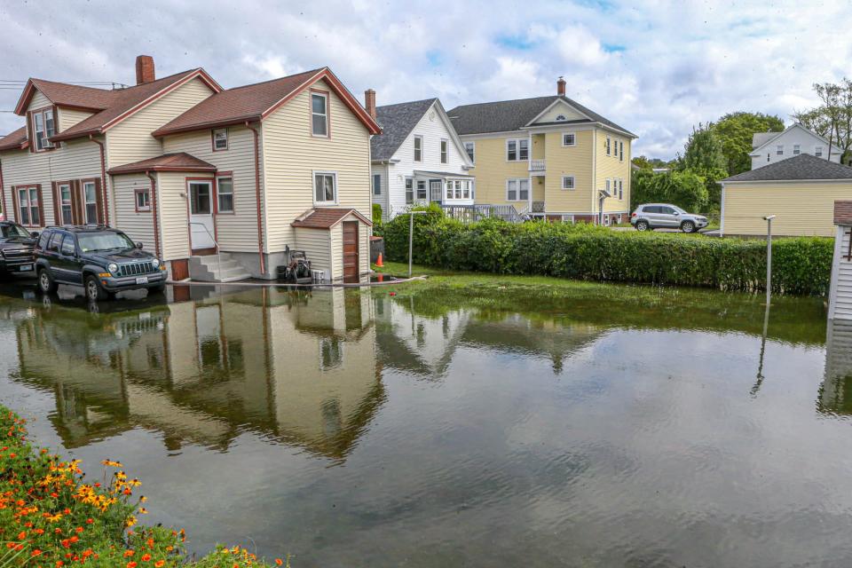 Backyards of homes on Washington Street in Bristol are flooded after a recent storm. The town is using a large chunk of its ARPA funds to improve drainage throughout the town.