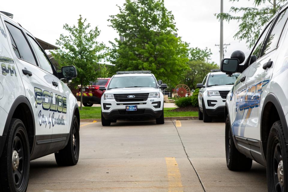 Coralville police cars are seen, Wednesday, May 27, 2020, outside City Hall in Coralville, Iowa.