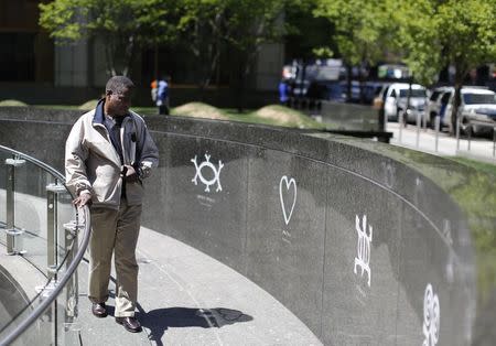 A man walks through the African Burial Ground National Monument in New York in his May 3, 2013 file photo. REUTERS/Brendan McDermid/Files