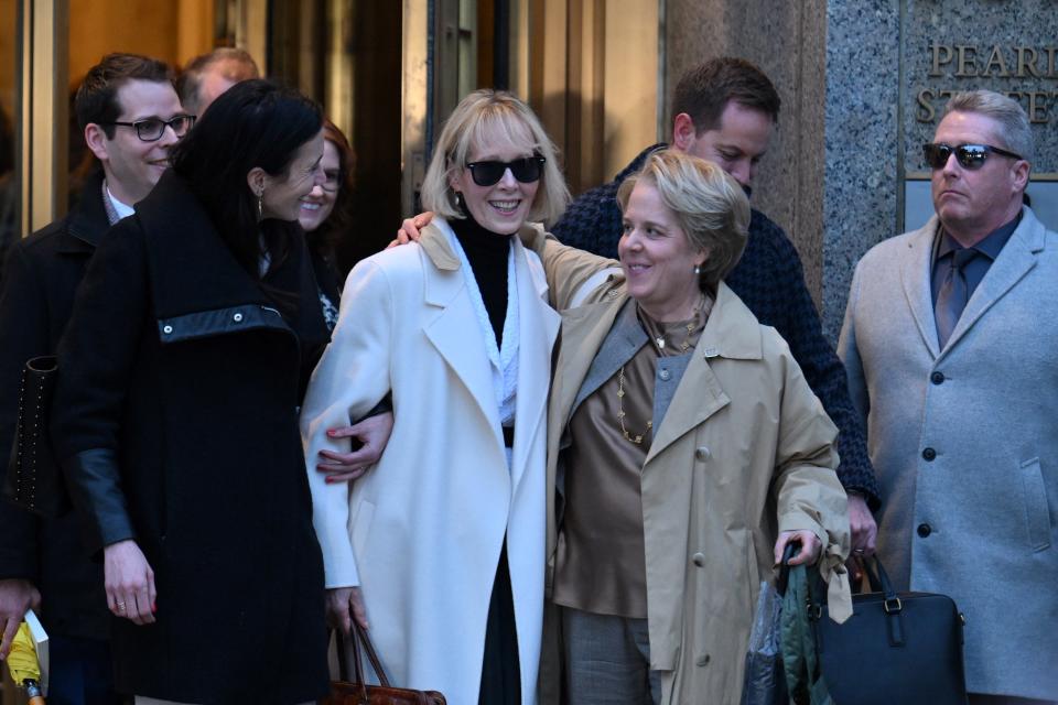 Writer E. Jean Carroll (C) leaves federal court after the verdict in her defamation case against former US president Donald Trump in New York on January 26, 2024. Trump was ordered Friday by a New York jury to pay $83 million in damages to Carroll, whom he publicly insulted and called a liar for alleging that he sexually assaulted her. The jury reached its decision after slightly less than three hours of deliberations. Trump made multiple comments about Carroll while he was president, demeaning her in the wake of her allegation of a 1990s assault.