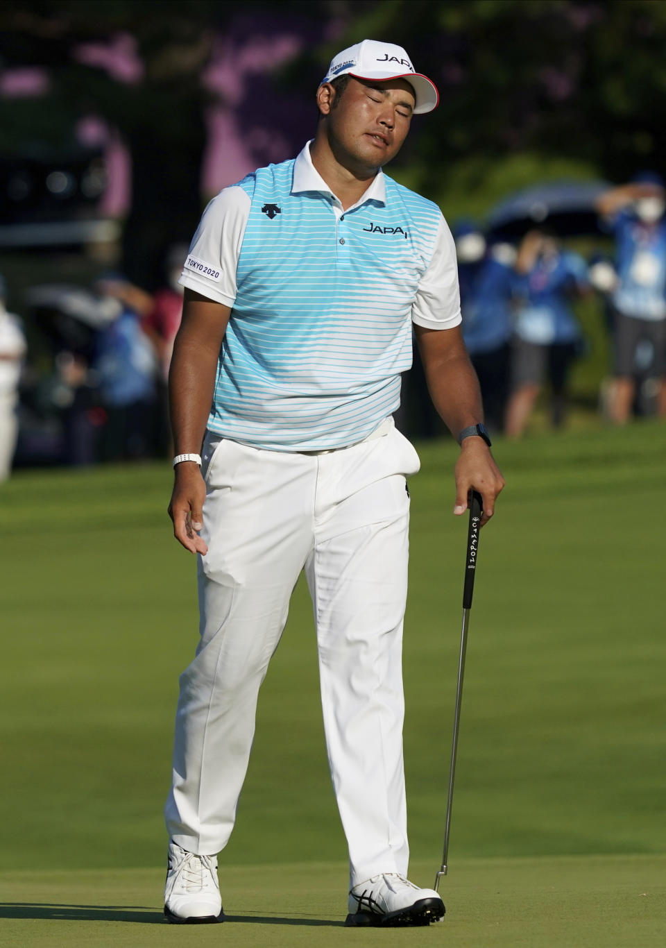 Hideki Matsuyama of Japan reacts after missing a putt during a bronze medal playoff of the men's golf event at the 2020 Summer Olympics on Sunday, Aug. 1, 2021, in Kawagoe, Japan. (AP Photo/Matt York)