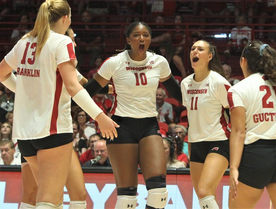 Wisconsin's Devyn Robinson (10) celebrates with Izzy Ashburn (11), Sarah Franklin (13) and Gulce Guctekin (21) during the team's match with Tennessee Sunday Sept. 3, 2023 at the UW Field House in Madison, Wis.