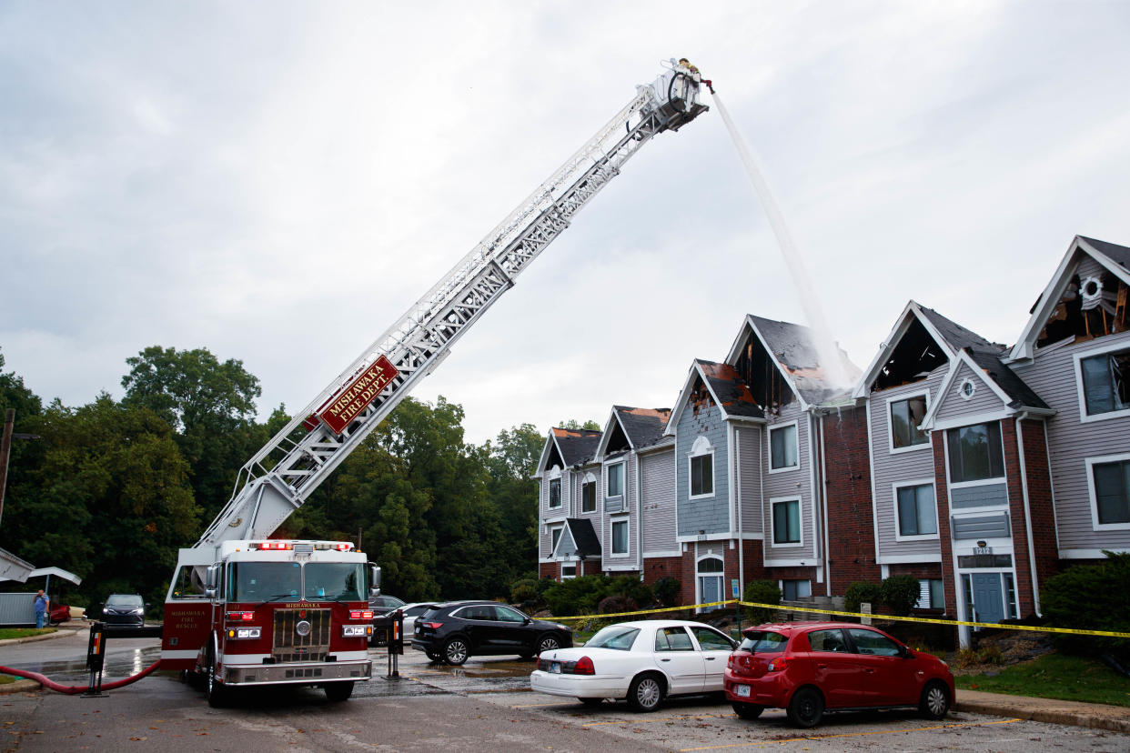 Firefighters work a scene of a fire in a residential building at Autumn Lakes Apartments and Townhomes on Wednesday, Aug. 28, 2024, in Mishawaka.