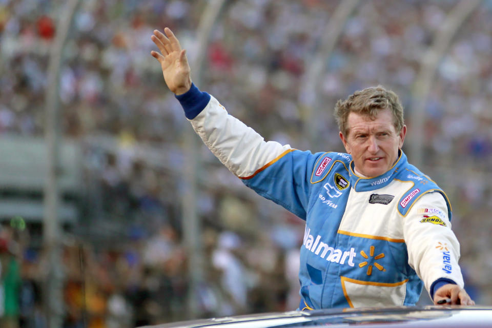 FILE - Bill Elliott waves to fans on pit road before the NASCAR Sprint Cup Series auto race at Daytona International Speedway in Daytona Beach, Fla., in this Saturday, July 7, 2012, file photo. Superstar Racing Experience was conceptualized as a series for former greats who still had the skills and desire to compete to square off in identically prepared cars at six of America’s classic short tracks. (AP Photo/John Raoux, File)